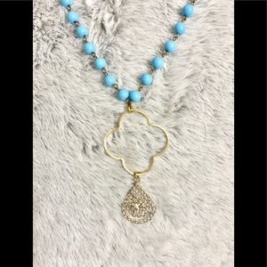 Long turquoise necklace w/ gold & crystal pendant